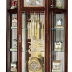 Howard Miller Liskov Floor Clock II 549-028 – Large Windsor Cherry Curio Cabinet with Cable-Drive, Triple-Chime Movement with Volume Control